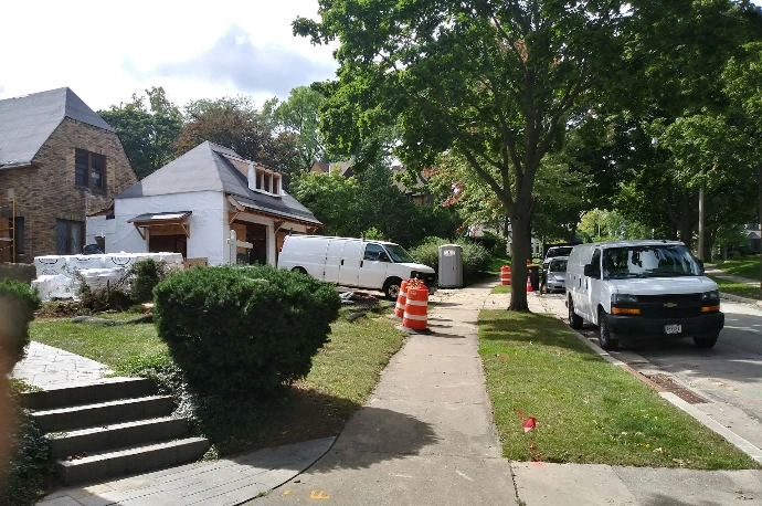 a white truck parked on the side of a road